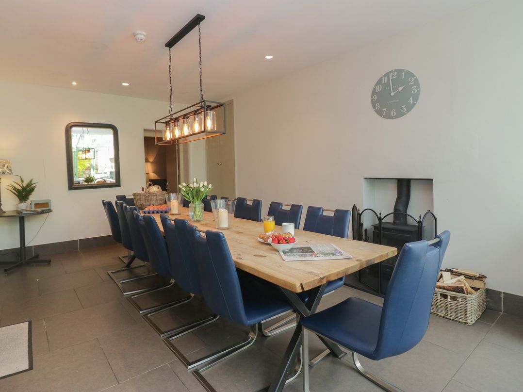 A dining room with a long table and chairs at The Boundary in Windermere