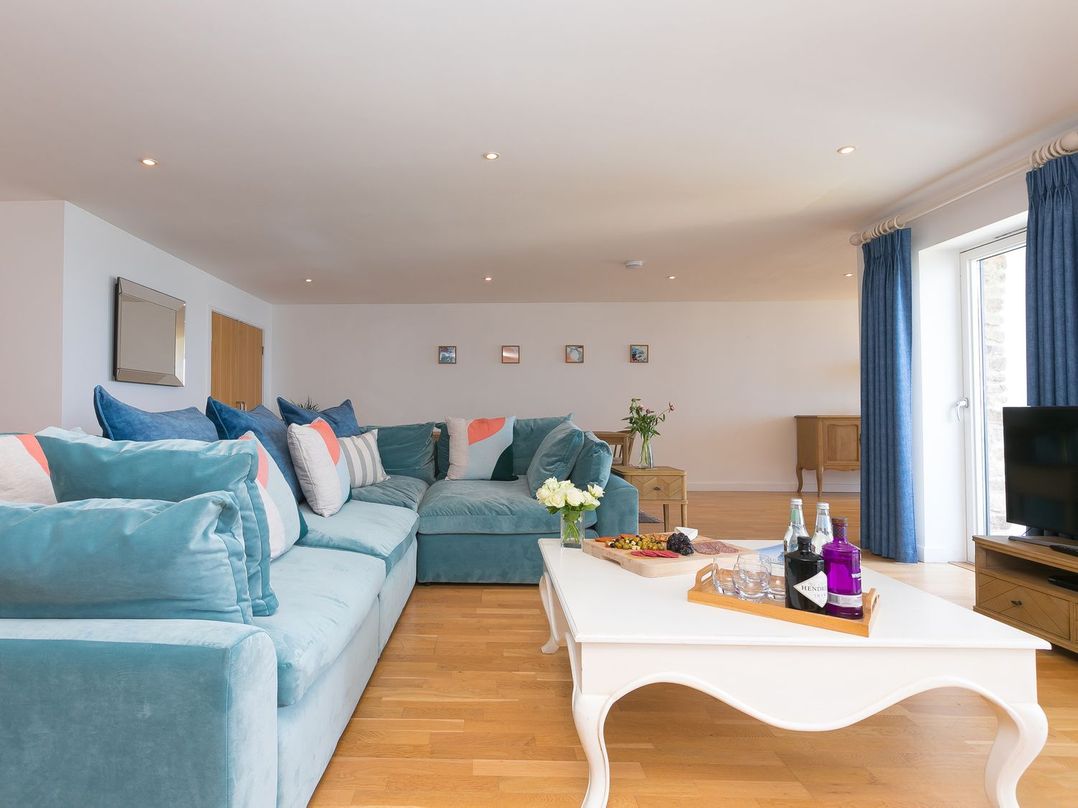 A living room with a sofa and coffee table at Mid Air in St. Ives