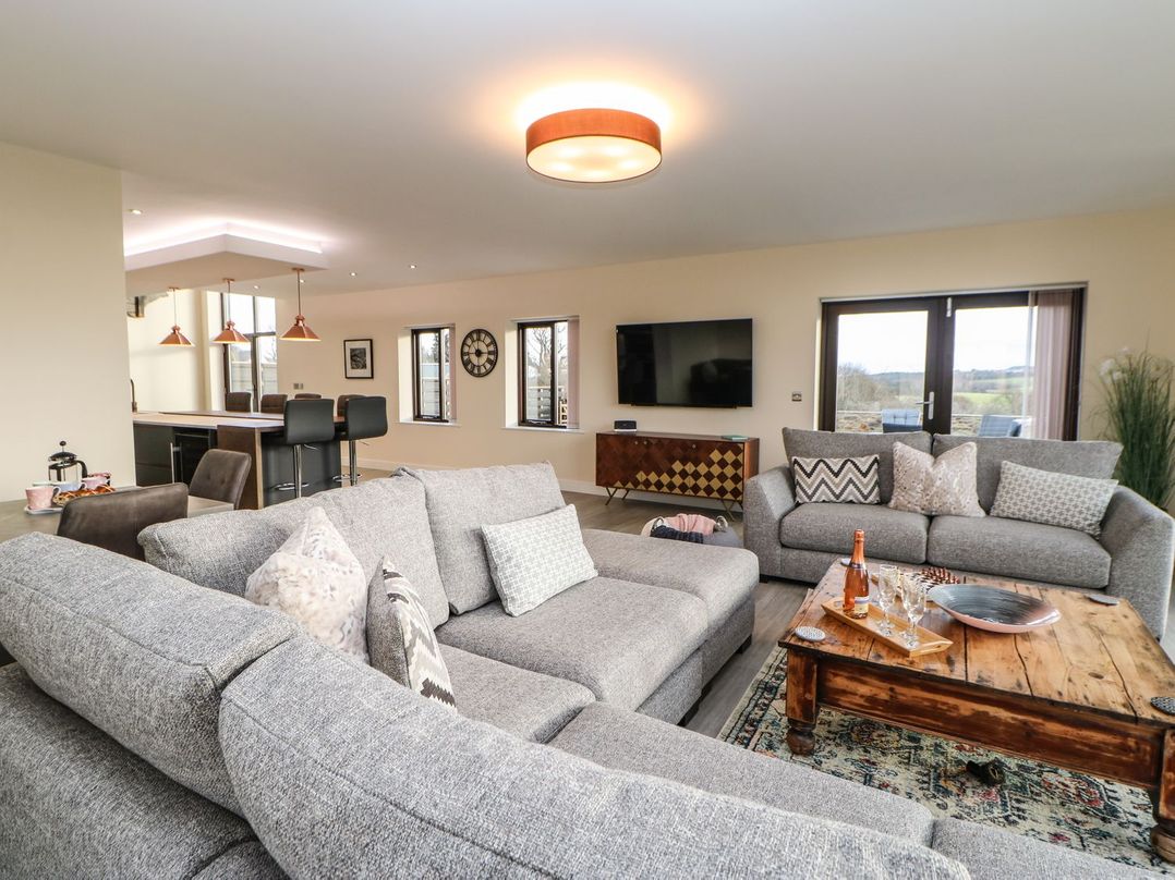 A living room with sofas and a coffee table at High Church Hill in Durham