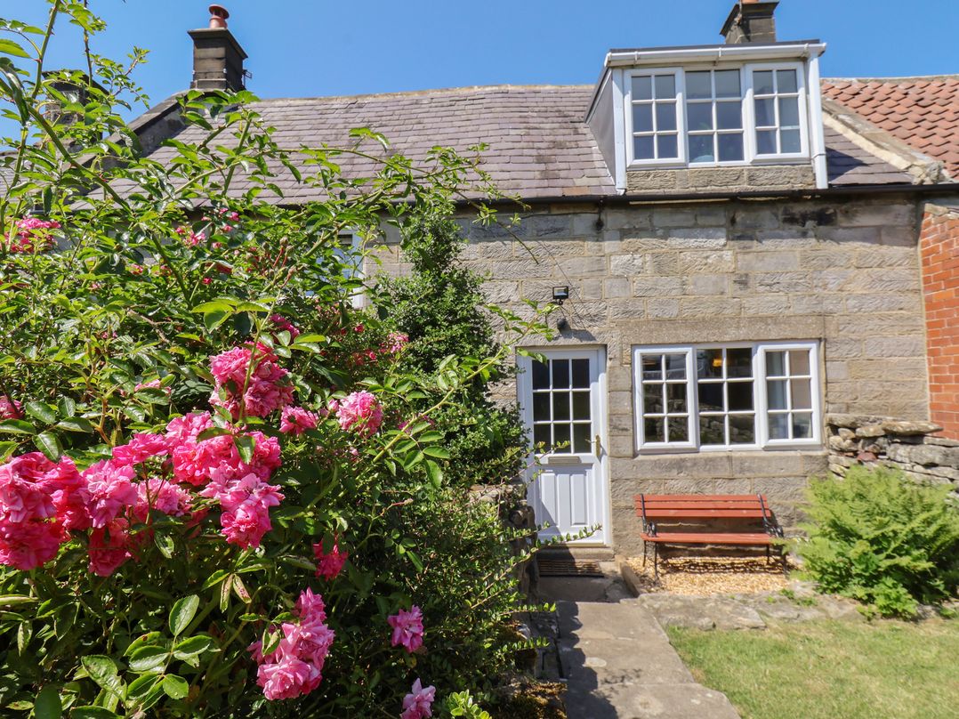 A house with flowers in the garden at 4 Lilac Cottages Ainthorpe