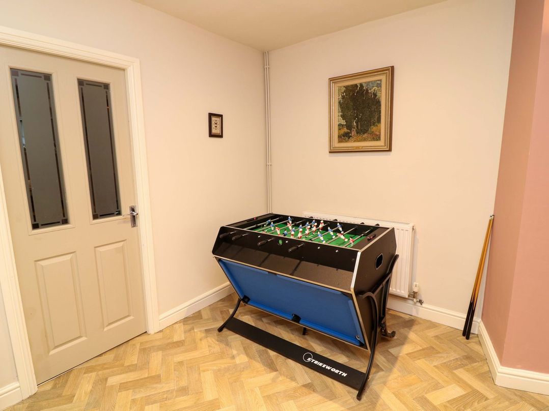 A game room with a foosball table and a door at The Annexe Belper