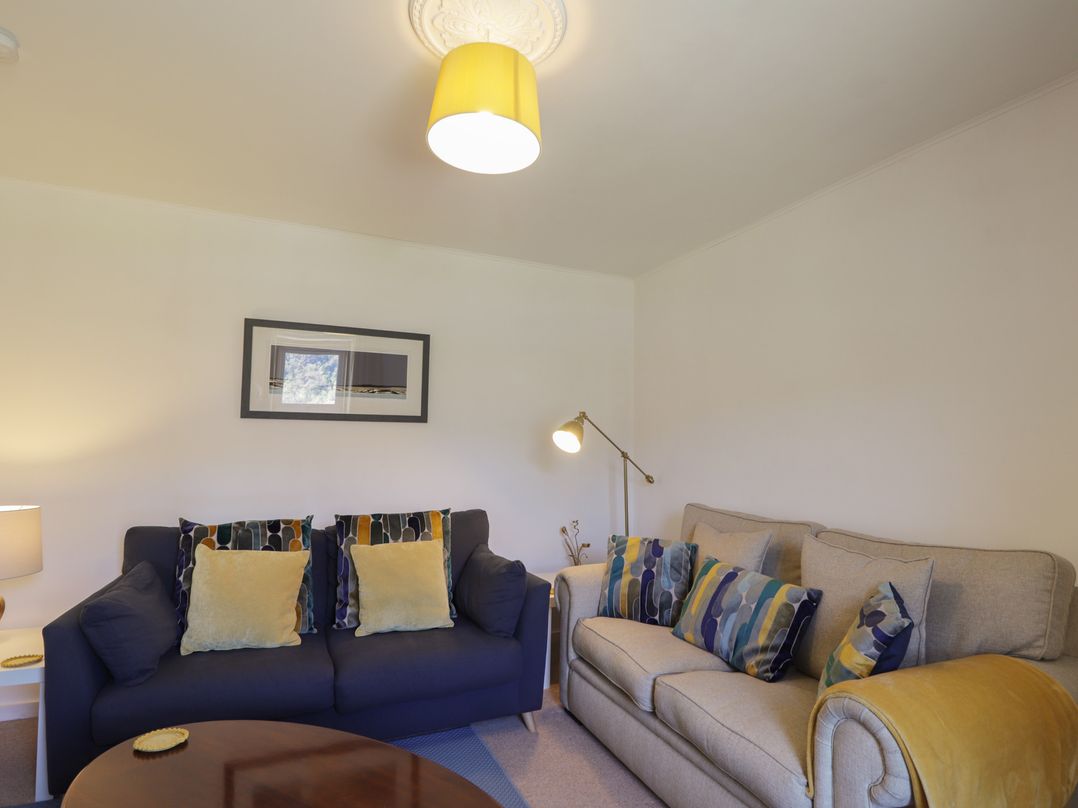 A living room with sofas and a coffee table at Tigh a Phailean in Letterfearn