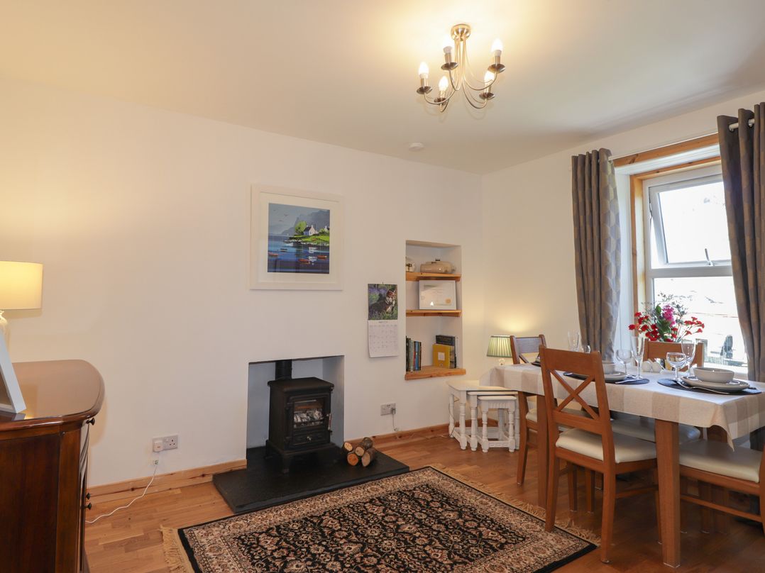 A dining room with a table and chairs at Tigh a Phailean in Letterfearn