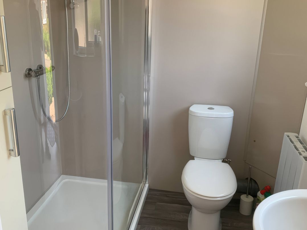 A bathroom with shower and toilet at Amber House in Dorchester