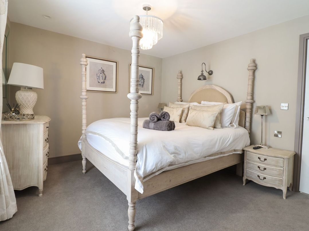 A bedroom with a bed and nightstand at 2 Llewelyn Street in Conwy