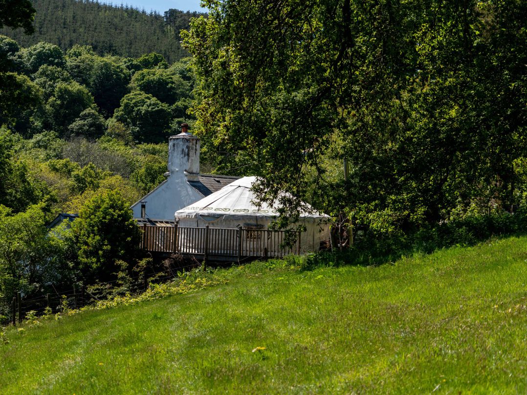 Yurts, barn and fire pit in a Snowdonia valley