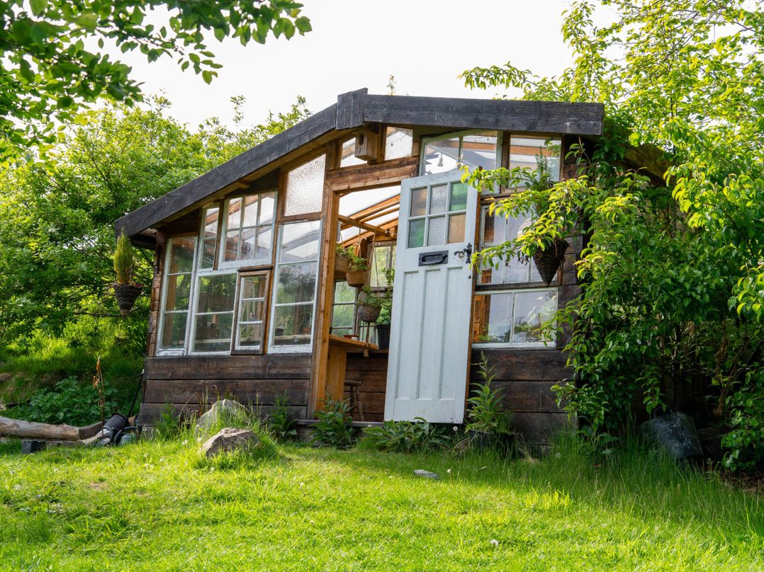 Yurts, barn and fire pit in a Snowdonia valley