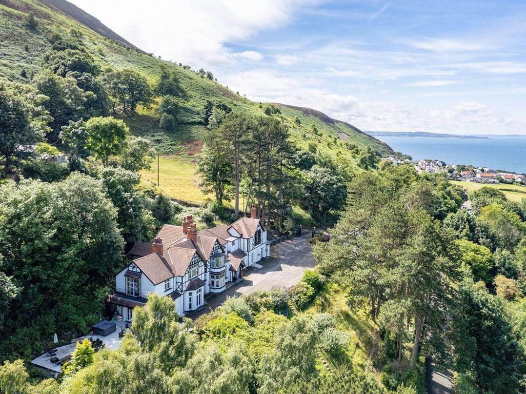 Tudor hall with hot tub, games room and sea views