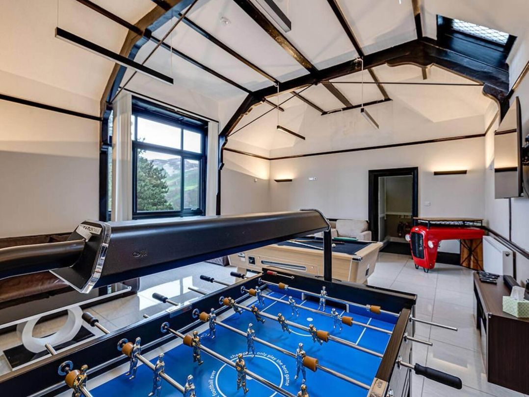 Tudor hall with hot tub, games room and sea views