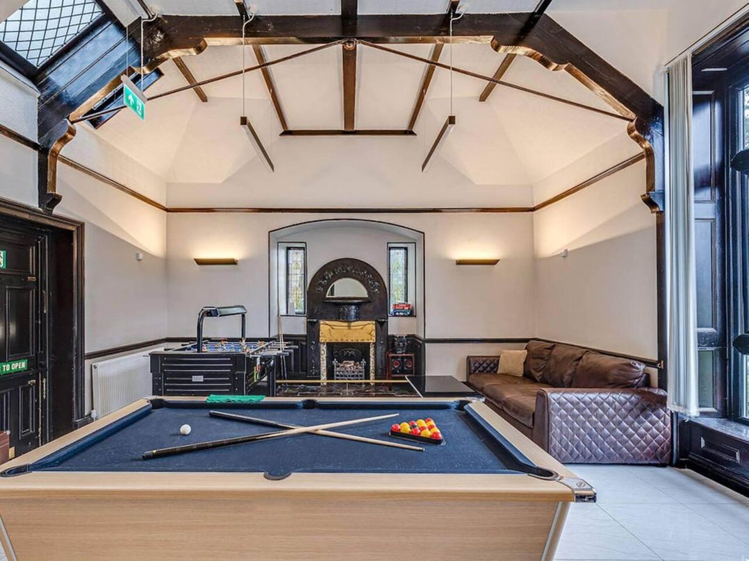 Tudor hall with hot tub, games room and sea views