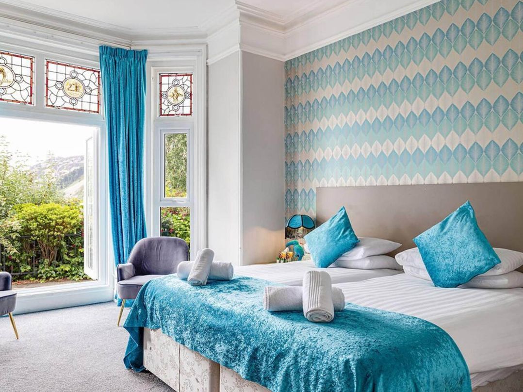 Tudor hall with hot tub, games room and sea views