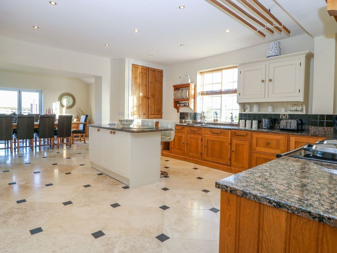 A kitchen with countertops and a dining area at Tuft House in Hovingham