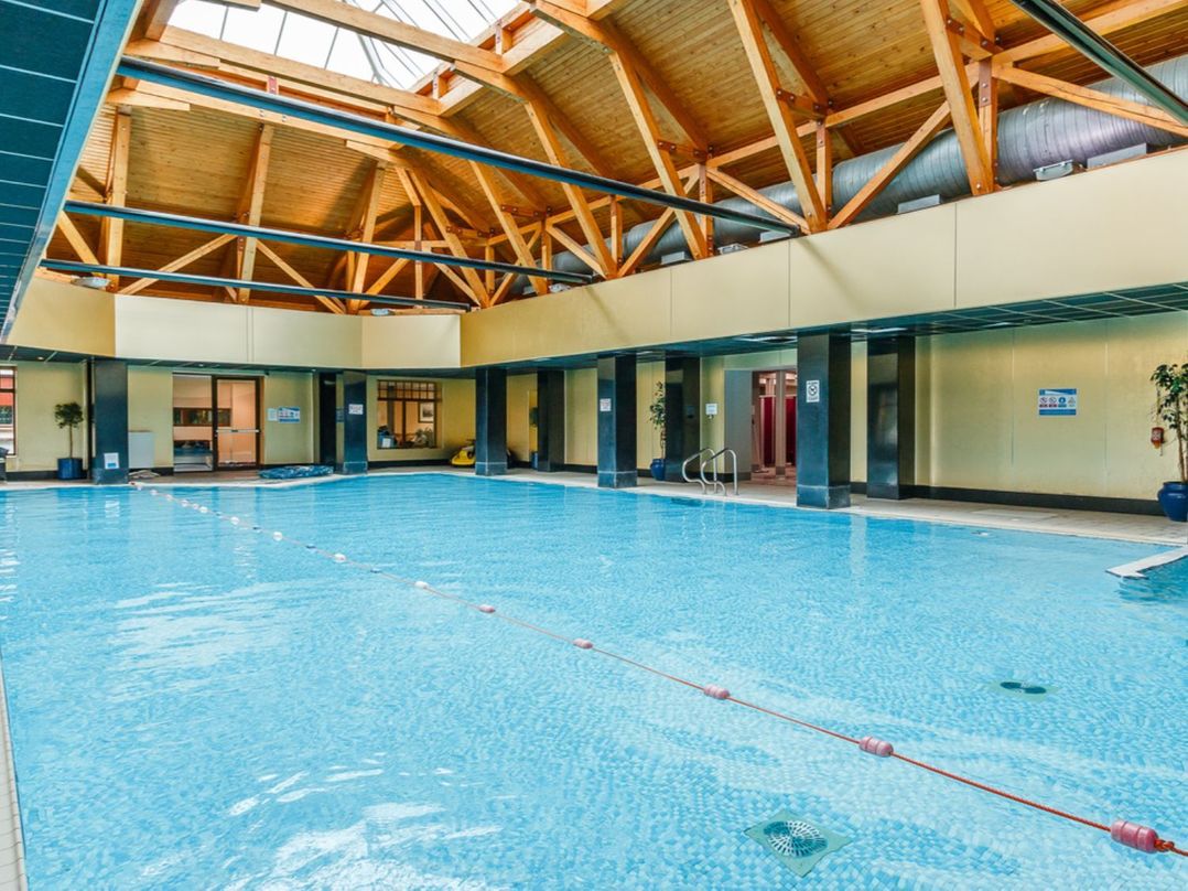 An indoor pool with a wooden ceiling at Sidlaw Spa in Fowlis near Dundee