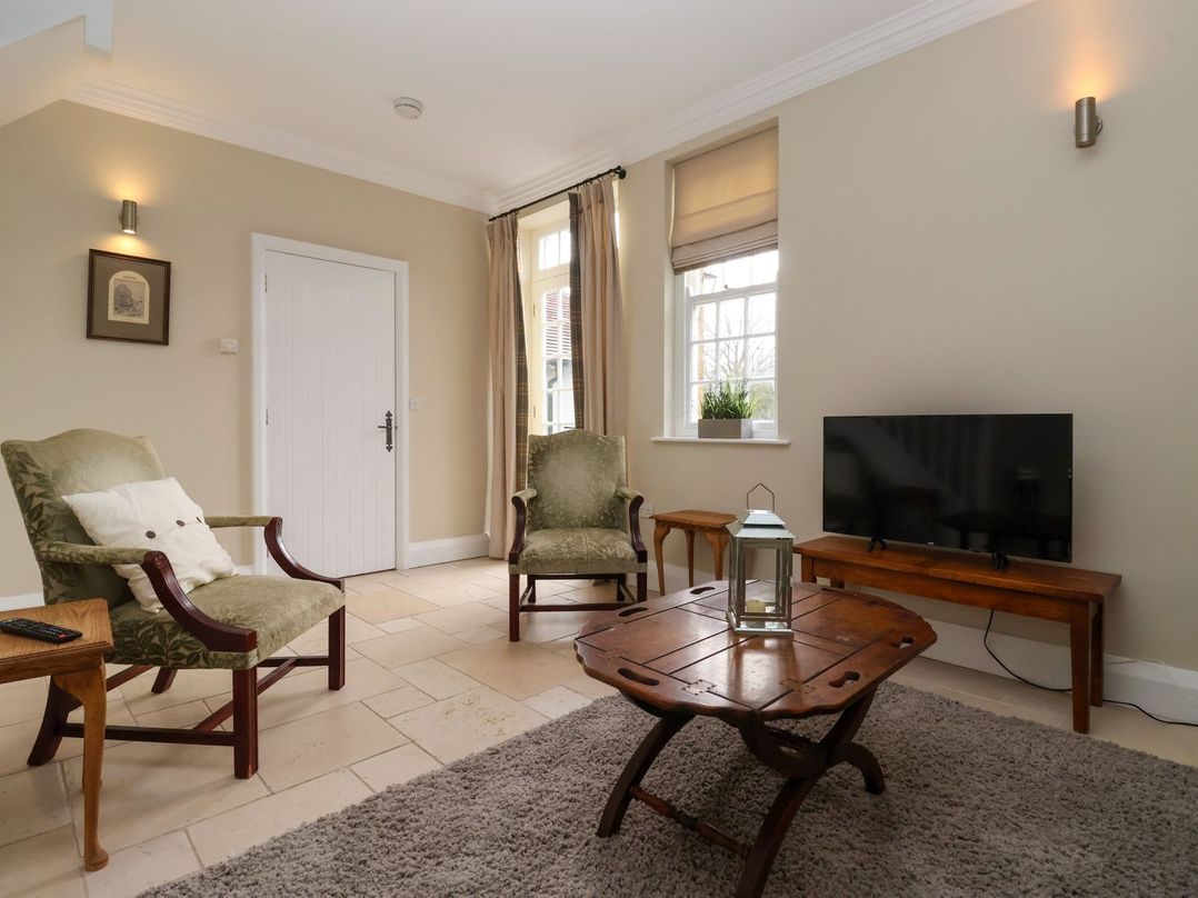 A living room with chairs and a table at The Bothy in Knaresborough