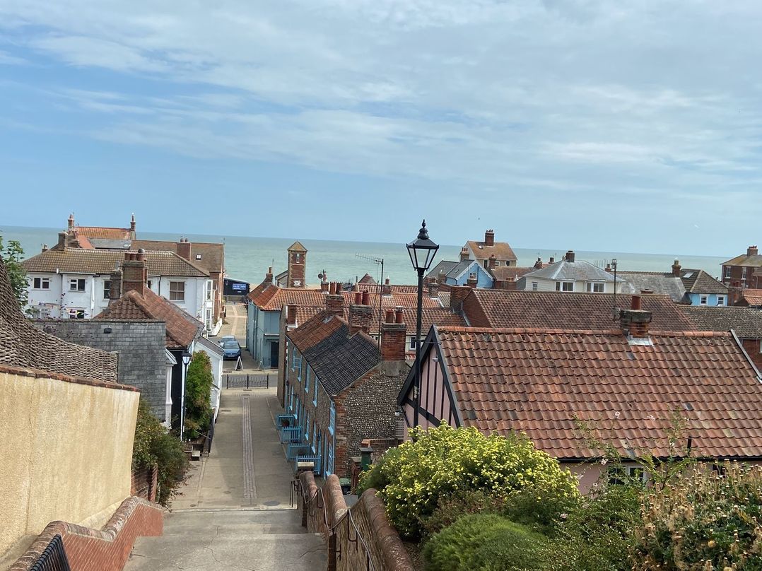 A view of rooftops and the sea at Lapwings, Aldeburgh