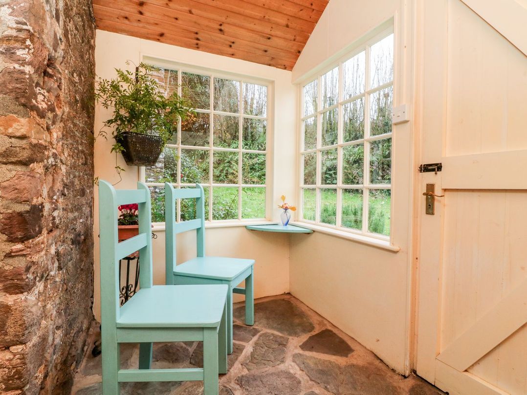 A corner with two chairs and a small table at Whitefield Cottage in Barnstaple