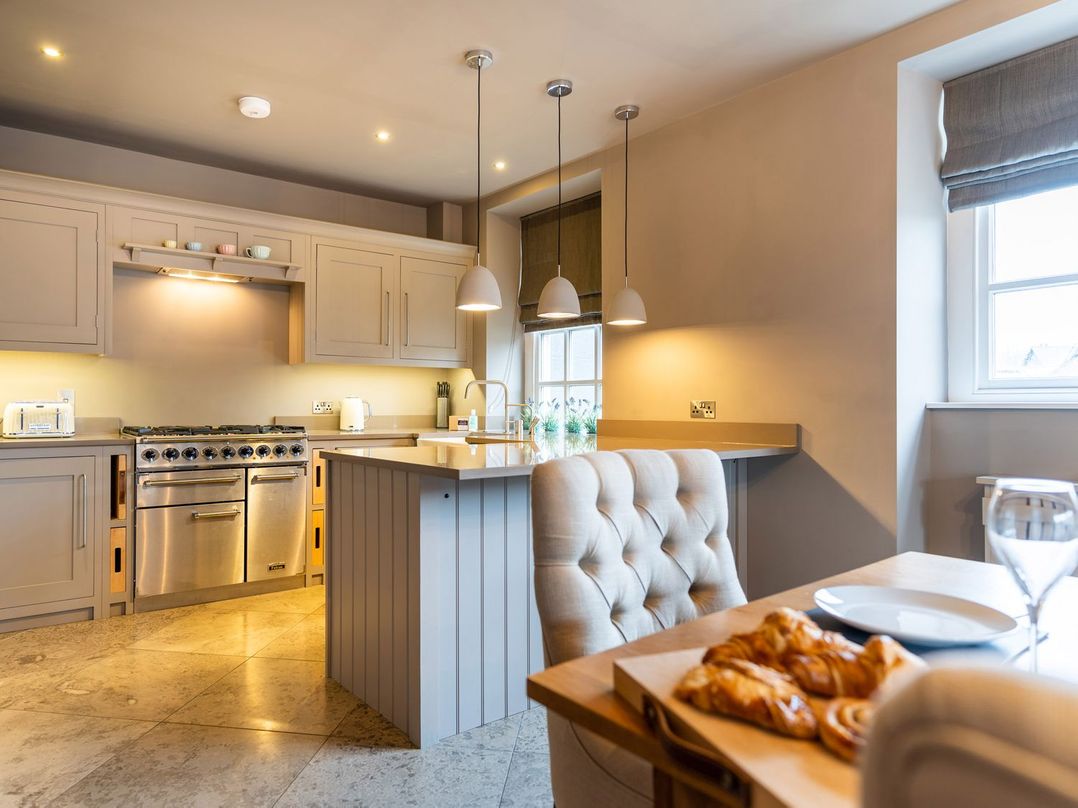 A kitchen with a stove and sink at Prospect House in Windermere