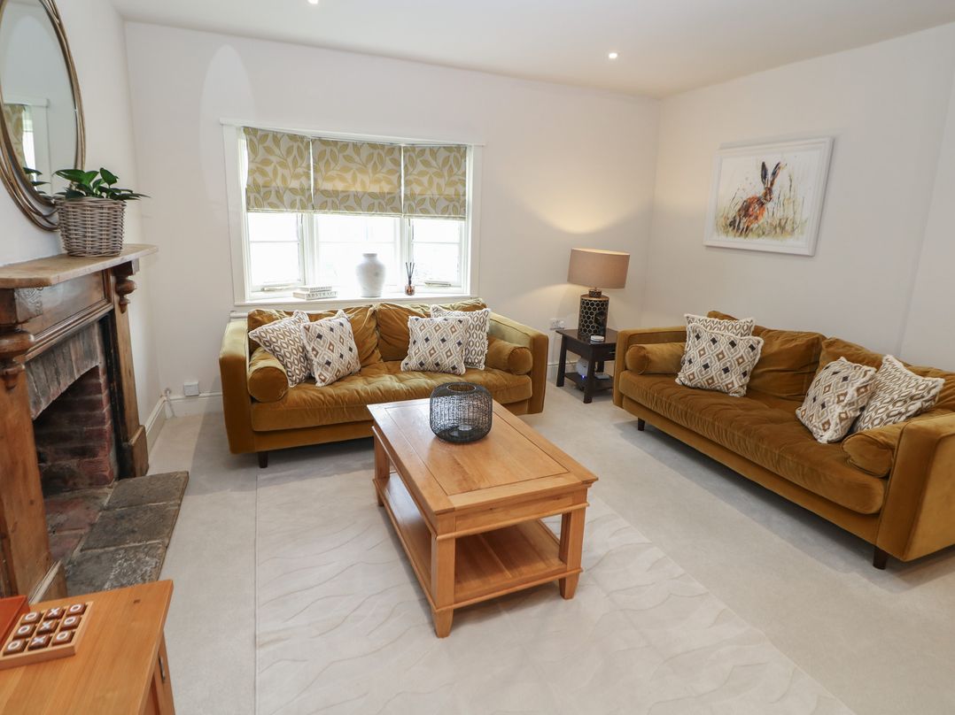 A living room with sofas and a coffee table at Lion House in Ashbourne