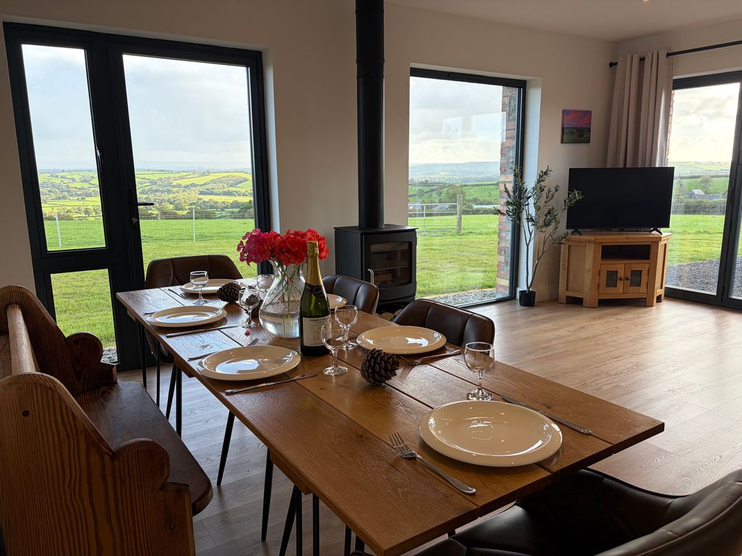 A dining room with a table set for dinner at High View Barn in Launceston