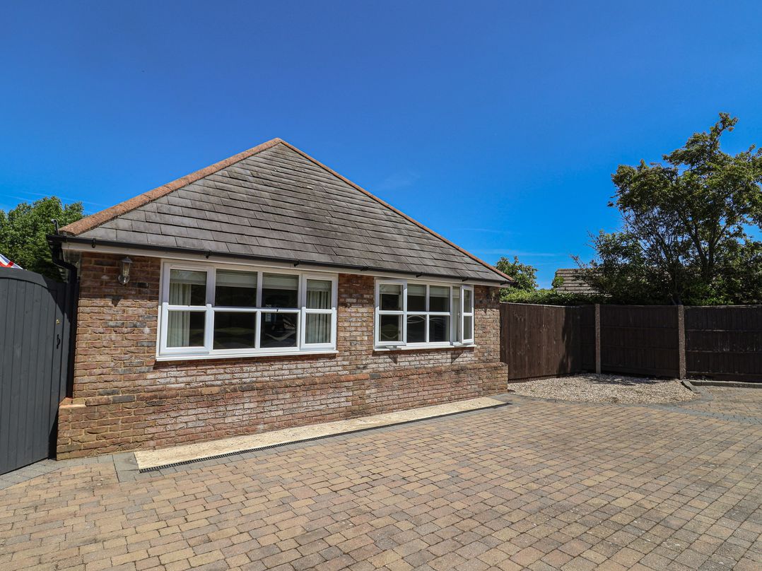 A house with windows and a driveway at Frome View Wool
