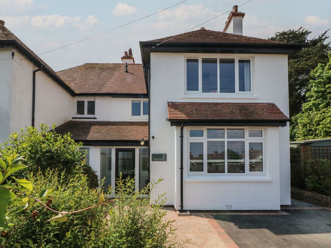 A house with windows and a front door at Wendy's Cottage in Minehead