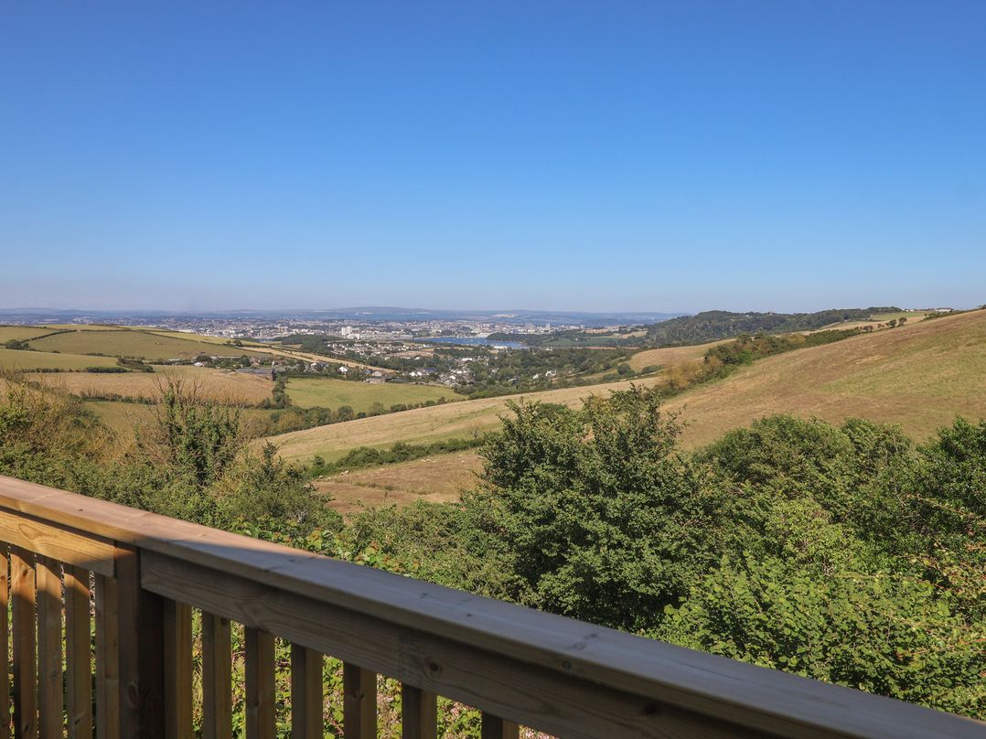 A scenic view of hills and a city in the distance at Lodge 19 Millbrook