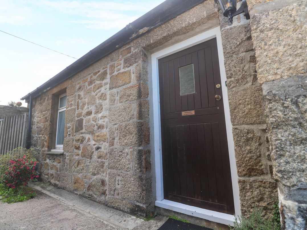 An exterior view of a building with a door and window at Chyancrowse in Gulval