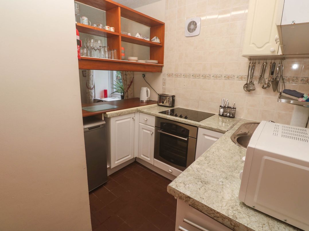 A kitchen with appliances and storage at Chyancrowse in Gulval