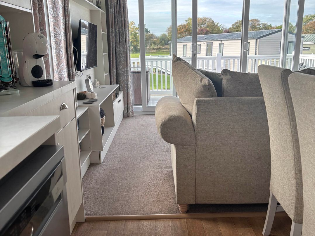 A living room with a sofa and television at Primrose Valley Park - Pebbles Retreat, Primrose Valley