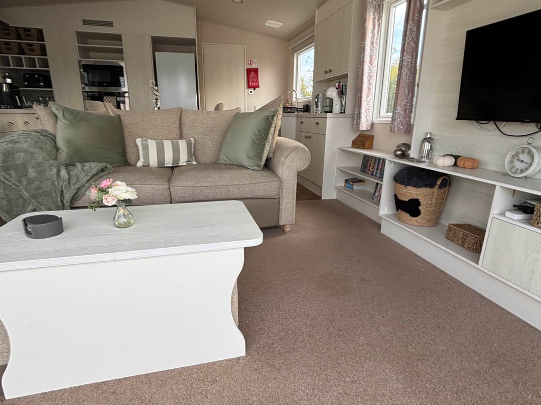A living room with a sofa and a coffee table at Primrose Valley Park - Pebbles Retreat in Primrose Valley