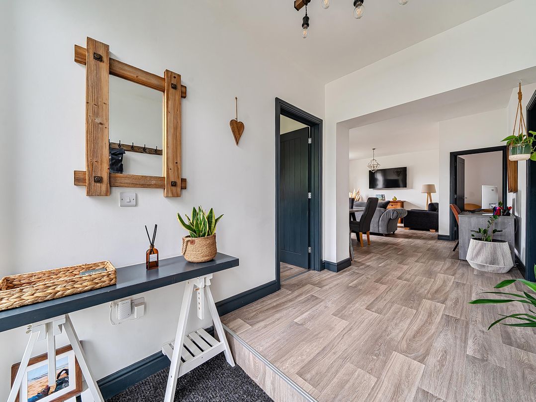 A hallway with a mirror and console table at Stunning Retreat in the Heart of Matlock Bath, Matlock Bath near Matlock