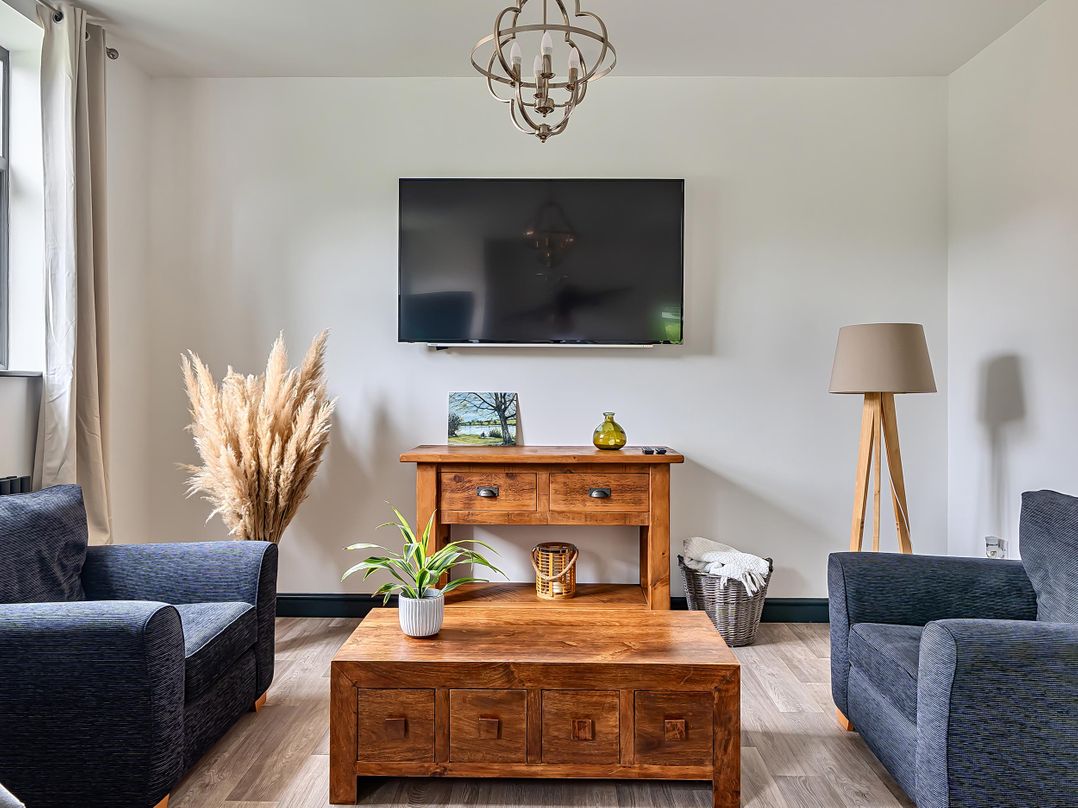 A living room with a sofa and coffee table at Stunning Retreat in the Heart of Matlock Bath near Matlock