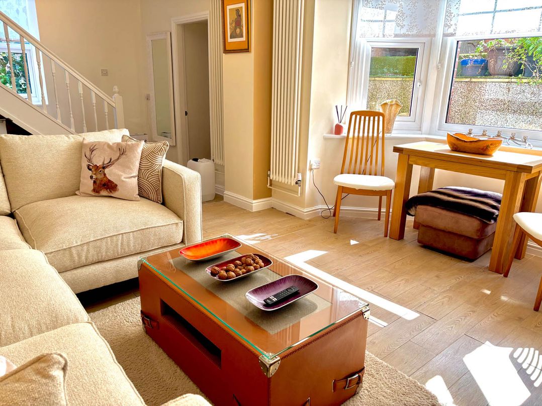 A living room with a coffee table and sofa at 5 Guests  2 Bedrooms  Free Parking 1min Beach Llandudno