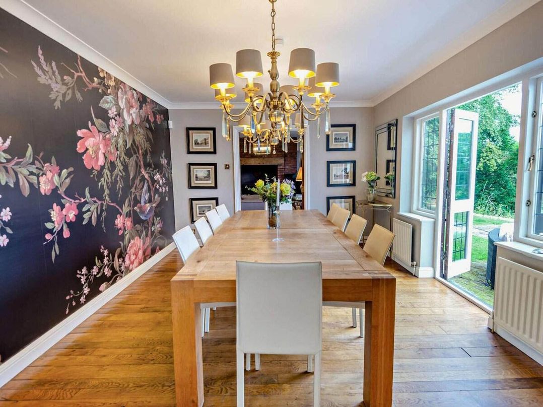 A dining room with a table and chairs at Luxurious 5 Bedroom House in Cookham near Marlow