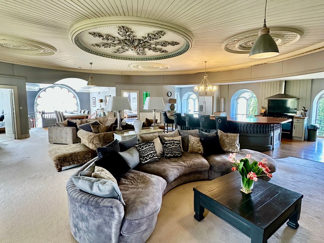 A living room with a sofa and coffee table at Capel Mawr Llanrug near Llanberis