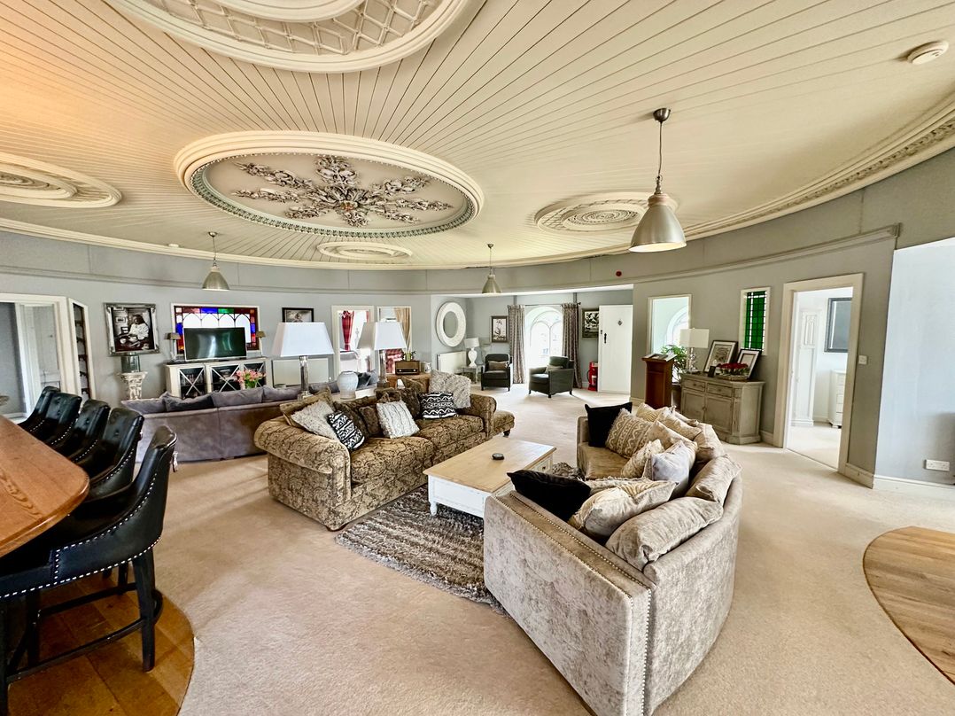 A living room with a sofa and coffee table at Capel Mawr Llanrug near Llanberis