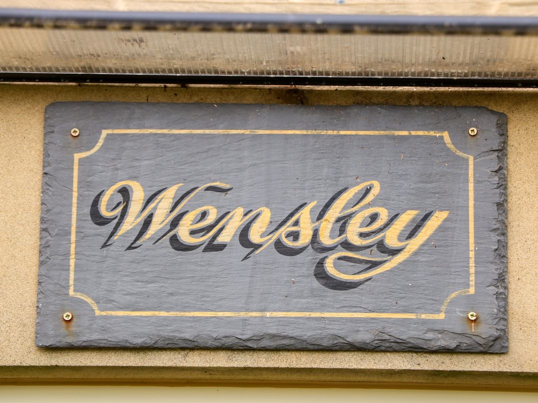 A sign displaying the name Wensley