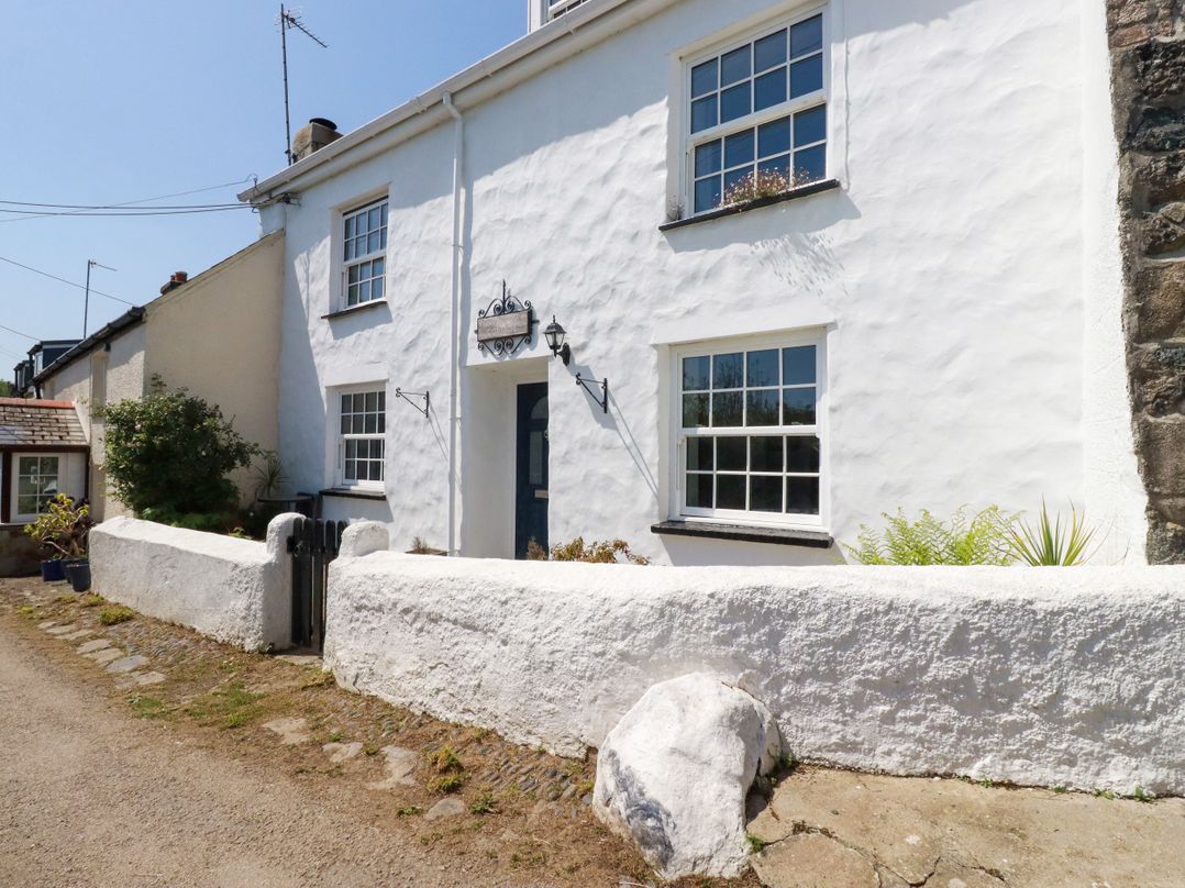 A house with windows and a door at Penrose Farm Cottage St Keverne