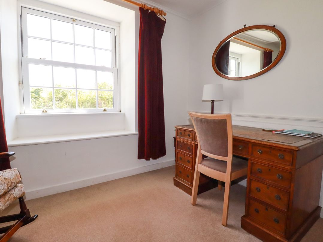 An office with a desk and a chair at Penrose Farm Cottage St Keverne