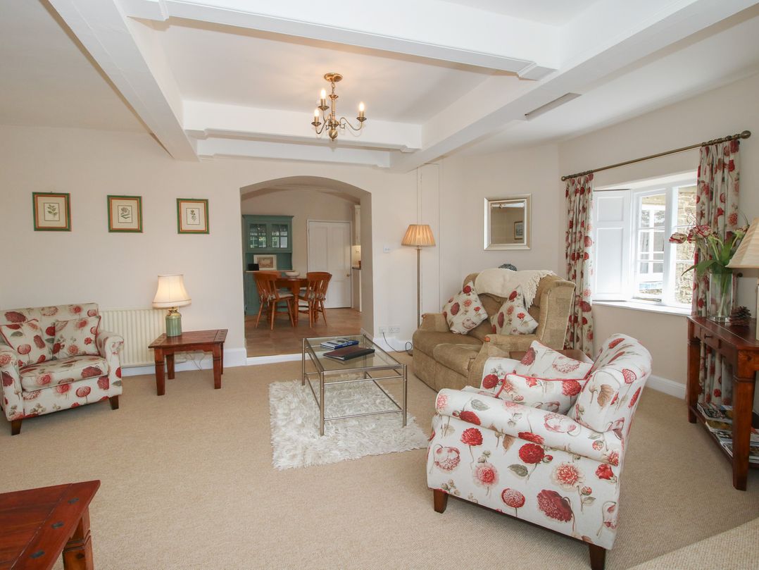 A living room with seating and a dining area at The Old Nursery in Bourton near Much Wenlock