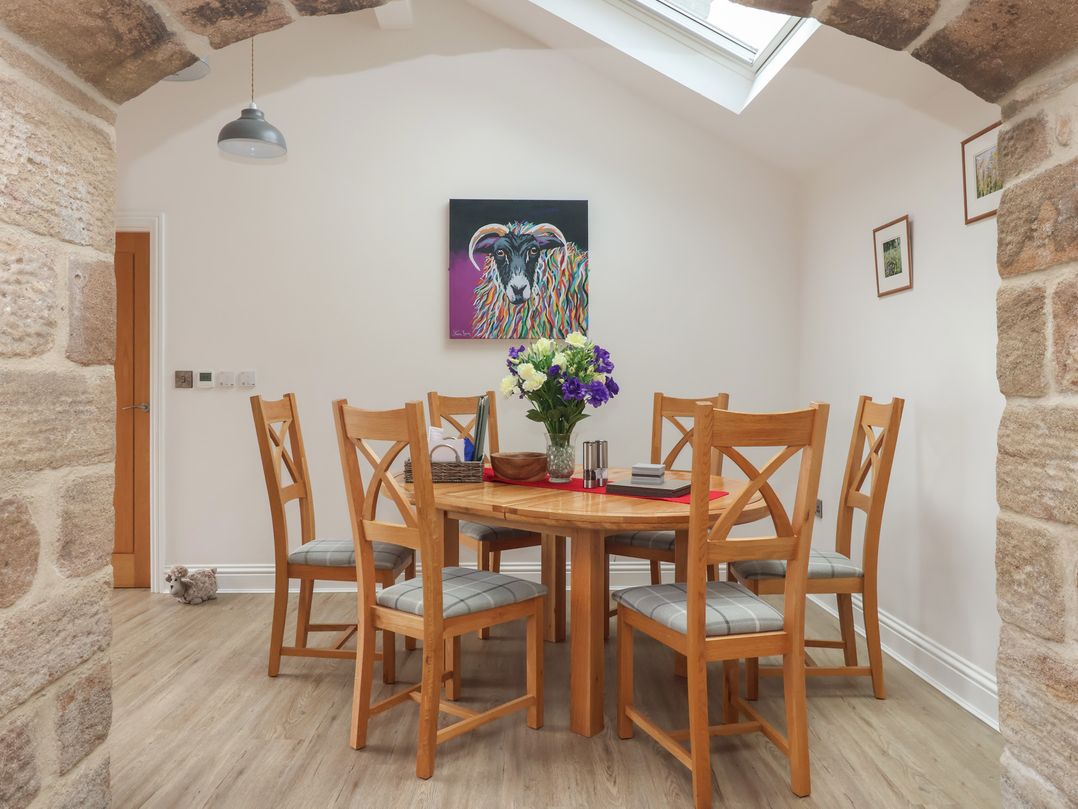 A dining room with a table and chairs at Shepherd's Crook in Follifoot near Spofforth