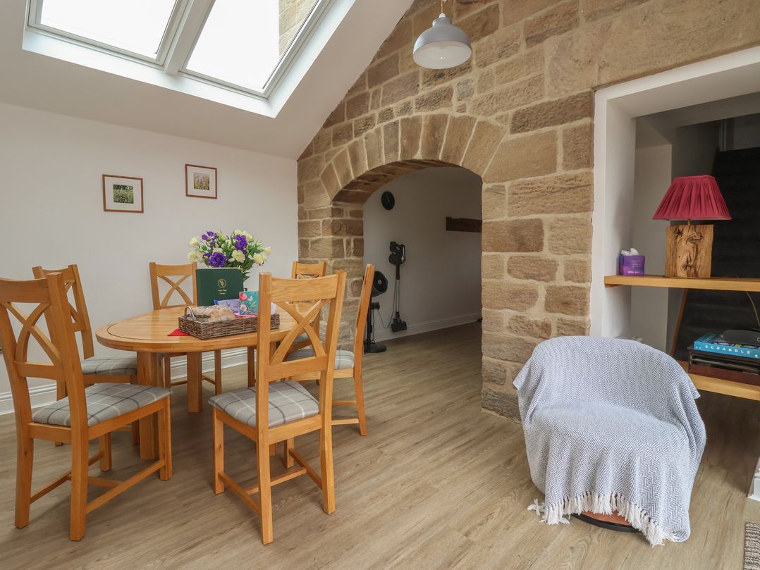 A dining room with a table and chairs at Shepherd's Crook Follifoot near Spofforth