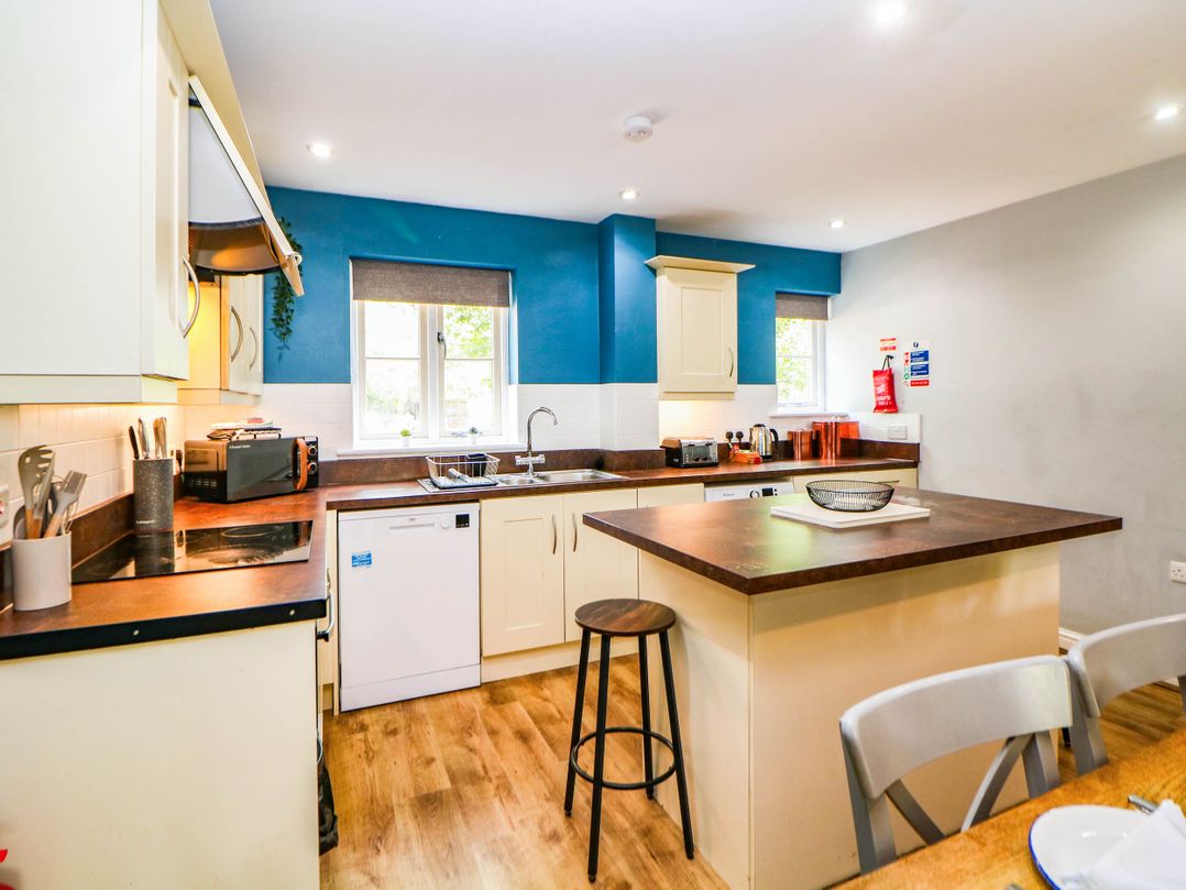 A kitchen with sink and appliances at Hassop in Matlock