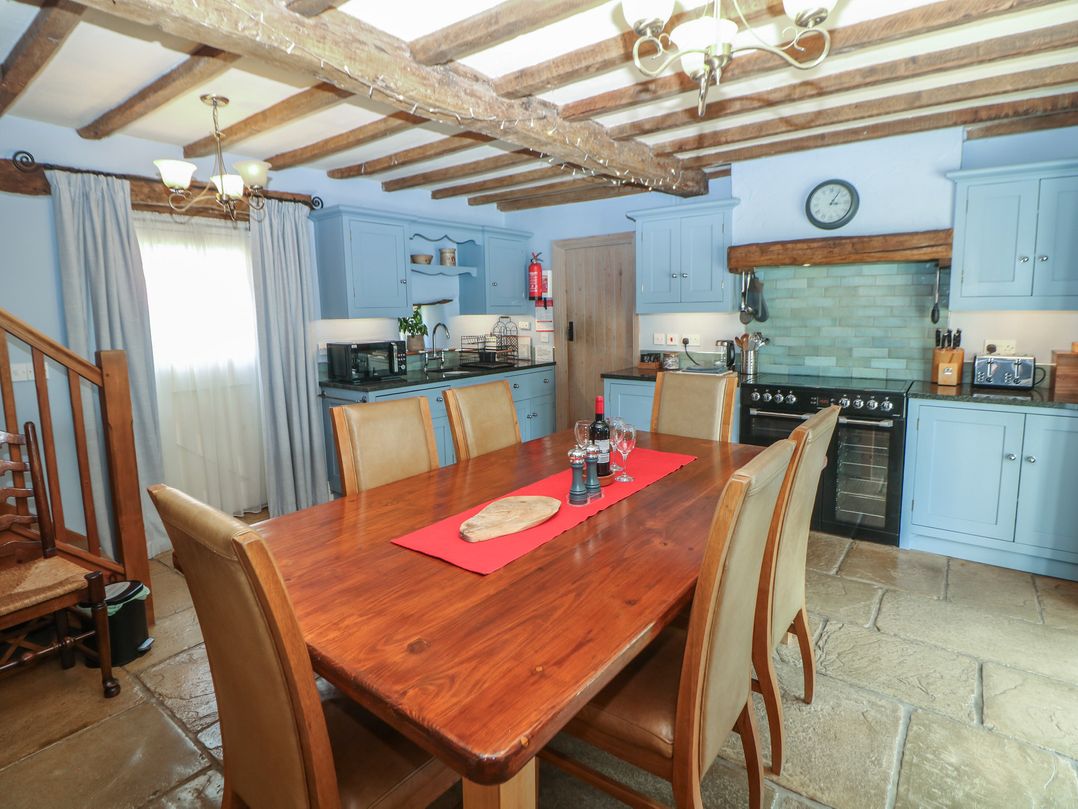 A kitchen with a dining table and chairs at Green Farm Stables Hognaston near Carsington Water