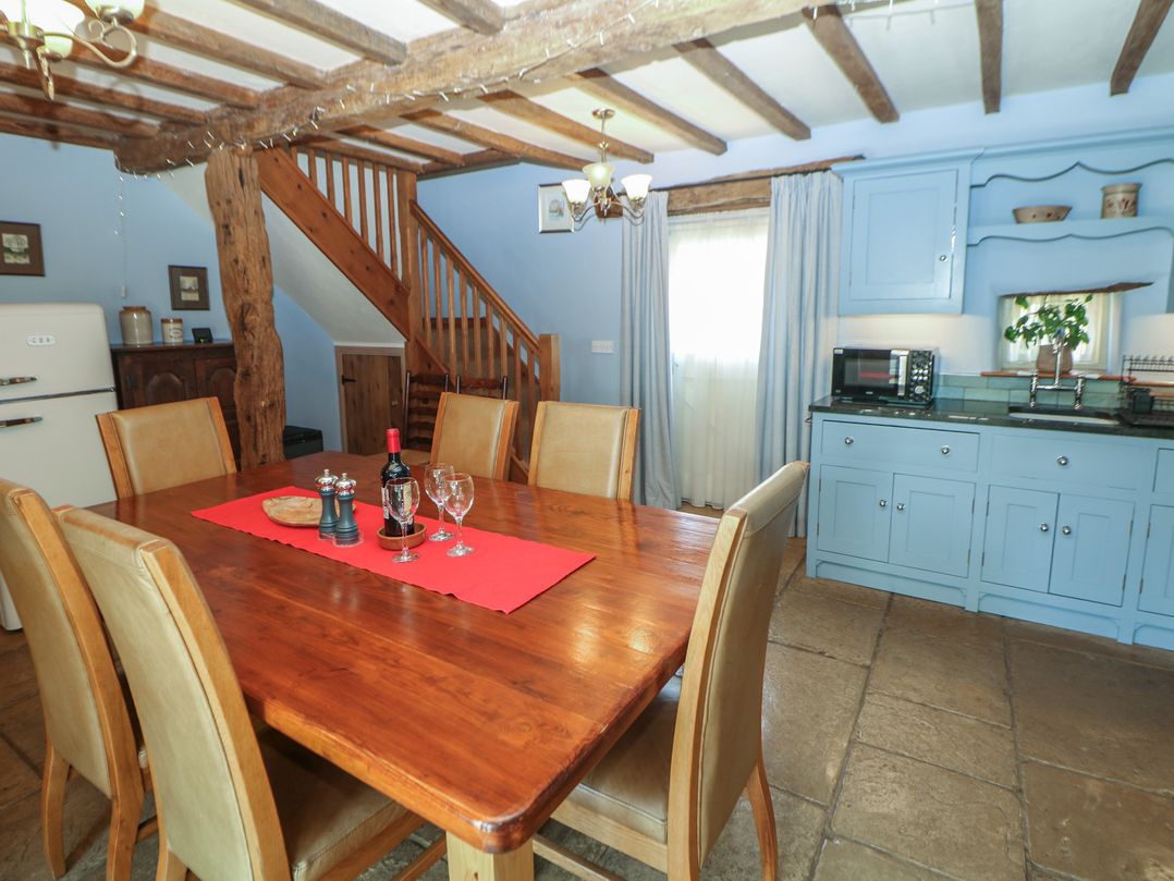 A kitchen with a dining table and chairs at Green Farm Stables Hognaston near Carsington Water