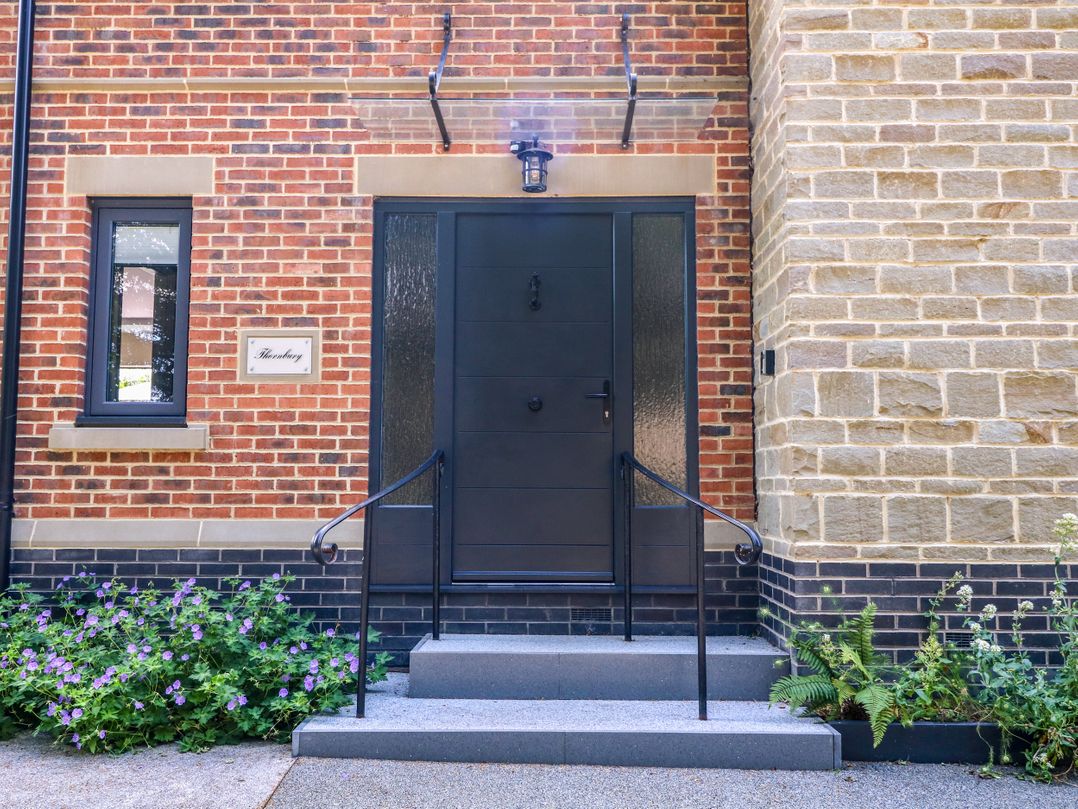 A door and steps at Thornbury in Barnard's Green, Malvern