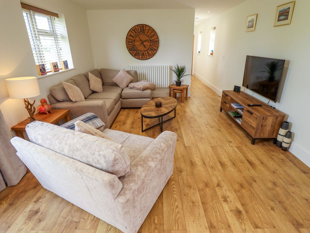 A living room with a sofa and coffee table at The New Build in South Reston near Louth
