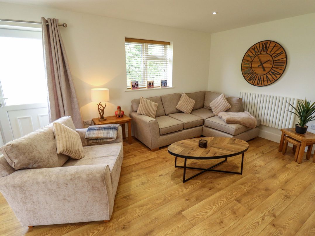 A living room with a sofa and coffee table at The New Build in South Reston near Louth