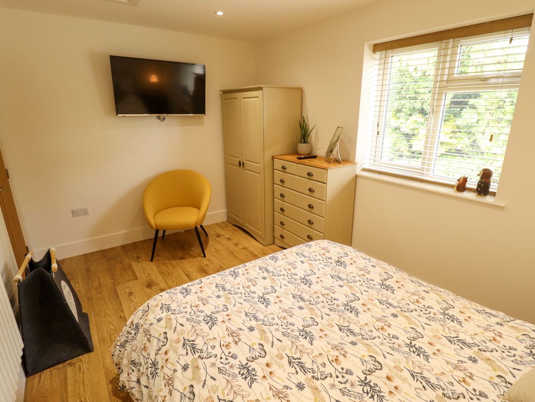 A bedroom with a bed and wardrobe at The New Build in South Reston near Louth