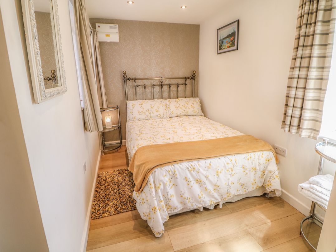 A bedroom with a bed and bedside table at The Netty in Flash